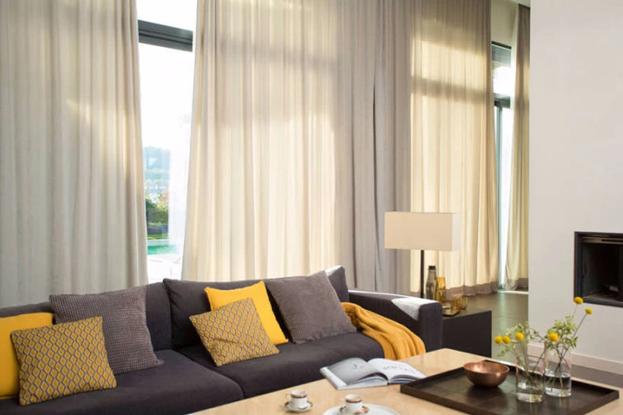 Grey blackout curtains in a modern Dubai apartment