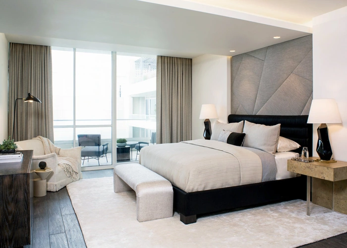 Luxurious bedroom in Dubai with sheer curtains and a balcony view.